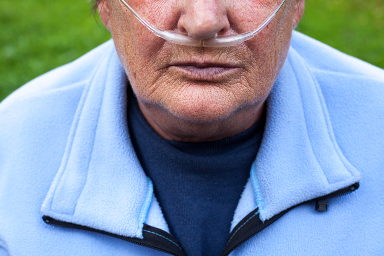 Senior with air tubes in the nose, Obstructive Pulmonary Disease (COPD)